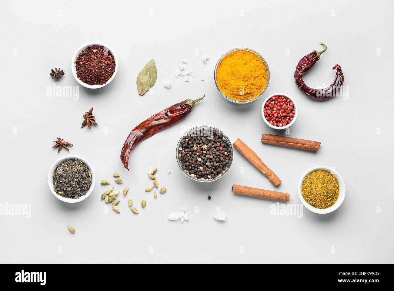 Bowls with aromatic spices on white background Stock Photo - Alamy