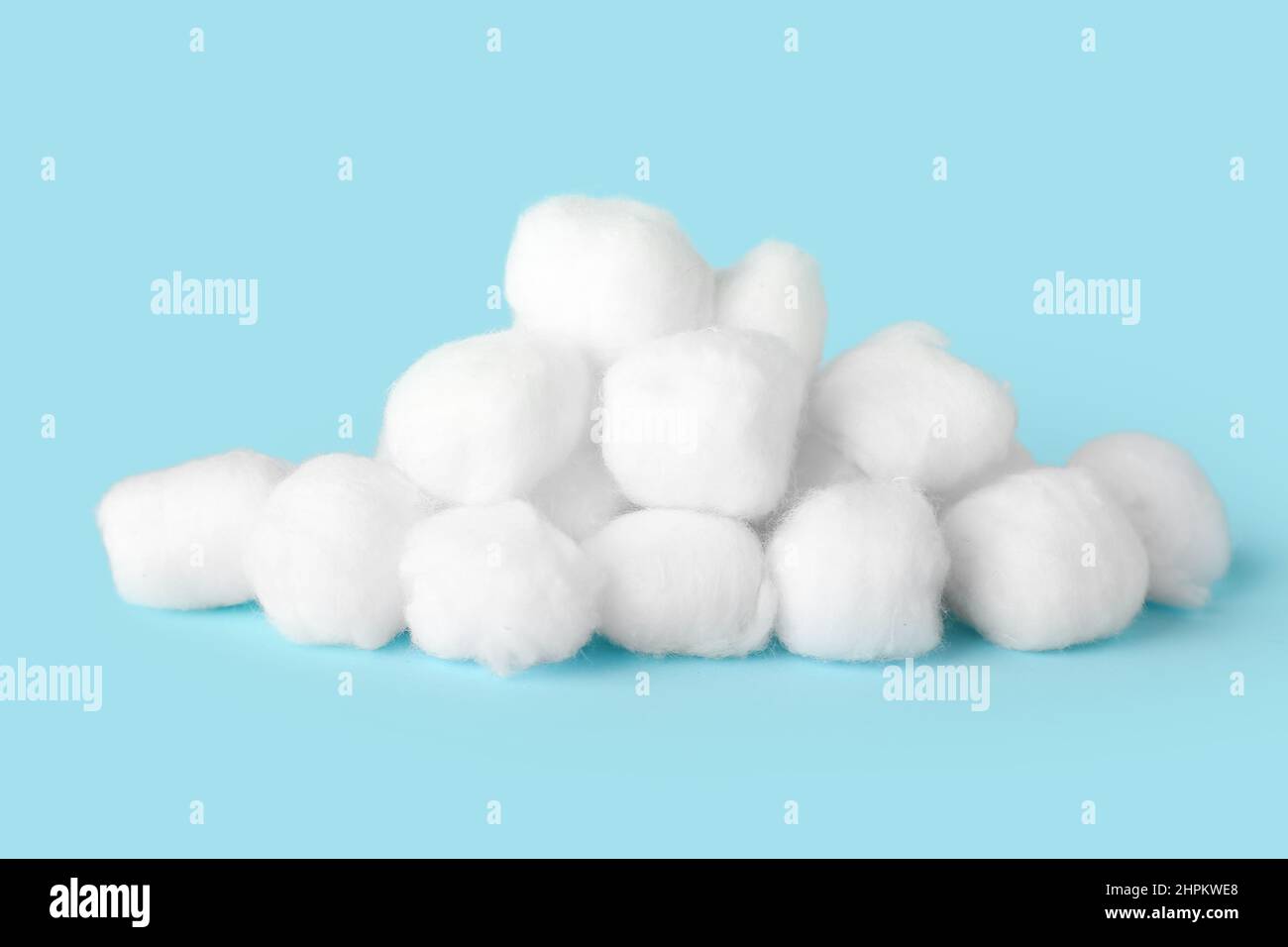 Heap of cotton balls on color background Stock Photo - Alamy