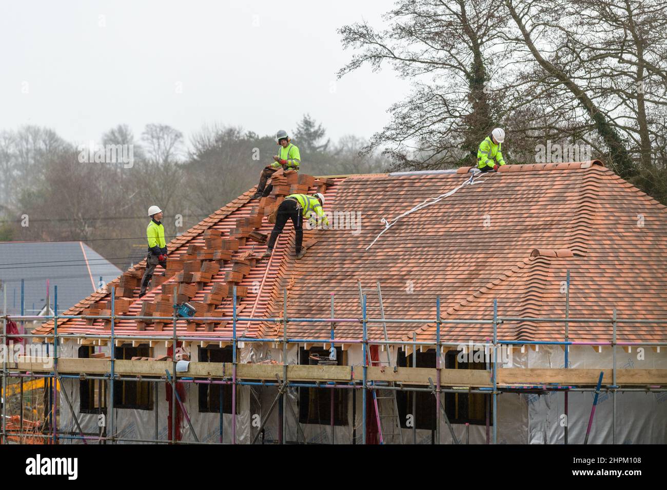 Working on roof Stock Photo Alamy