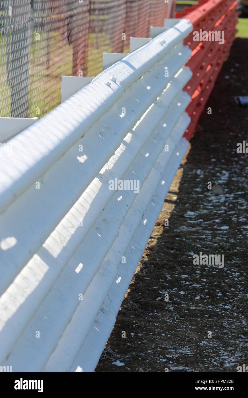 Red and White racing Armco safety Barrier Stock Photo Alamy