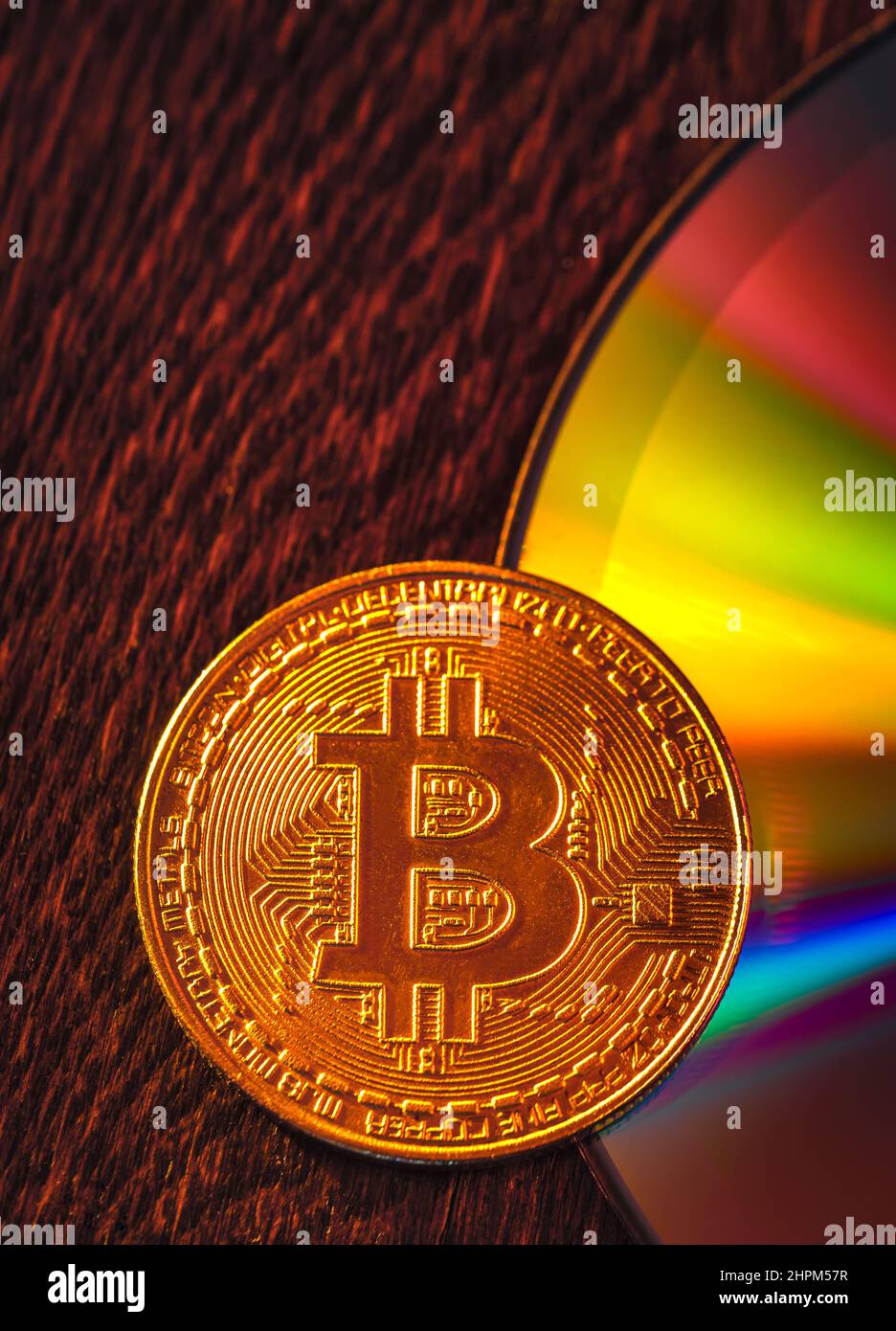 Bitcoin coin on a CD - DVD, background for design Stock Photo