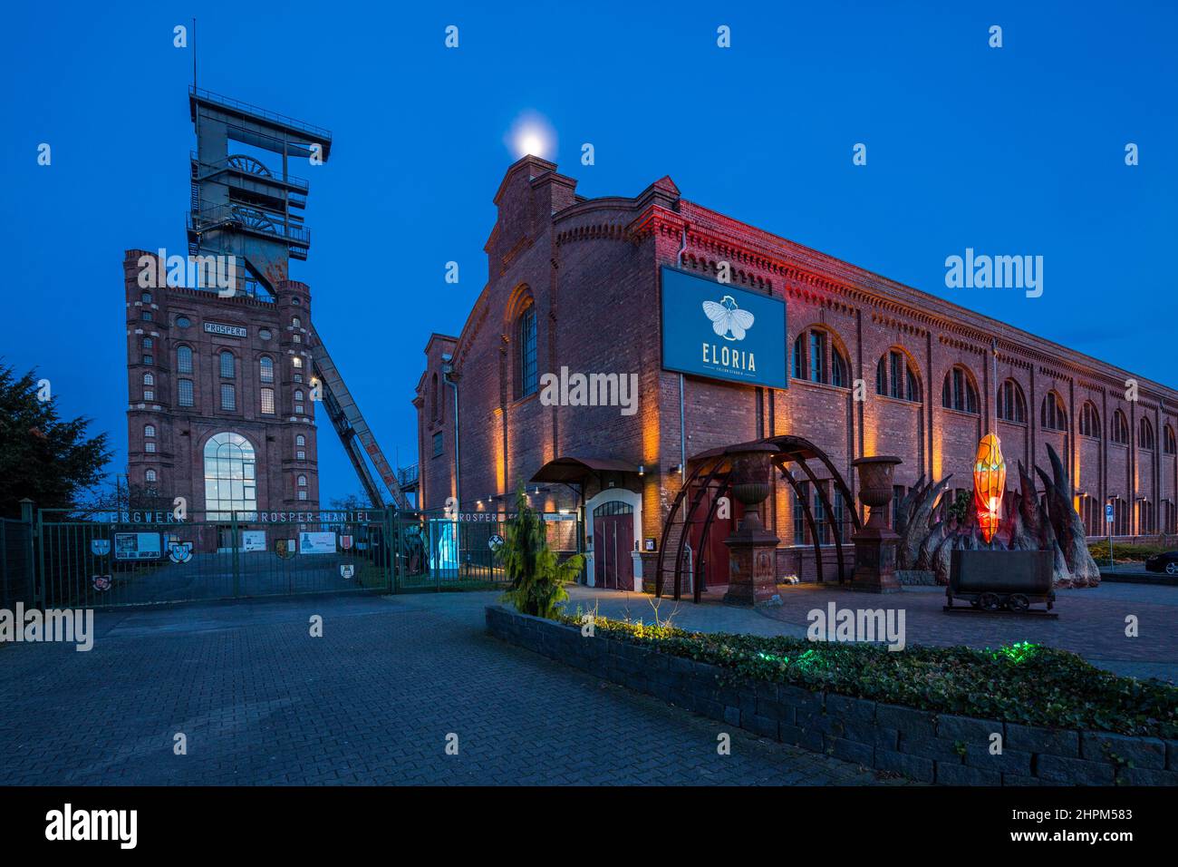Germany, Bottrop, Ruhr area, Westphalia, North Rhine-Westphalia, NRW, Route of Industrial Heritage, hard coal mining industry, coalmine Prosper-Haniel, shaft tower Prosper II, Malakoff tower with headframe and former pithead bath, nowadays FLORIA adventure factory and catering trade, night photograph Stock Photo