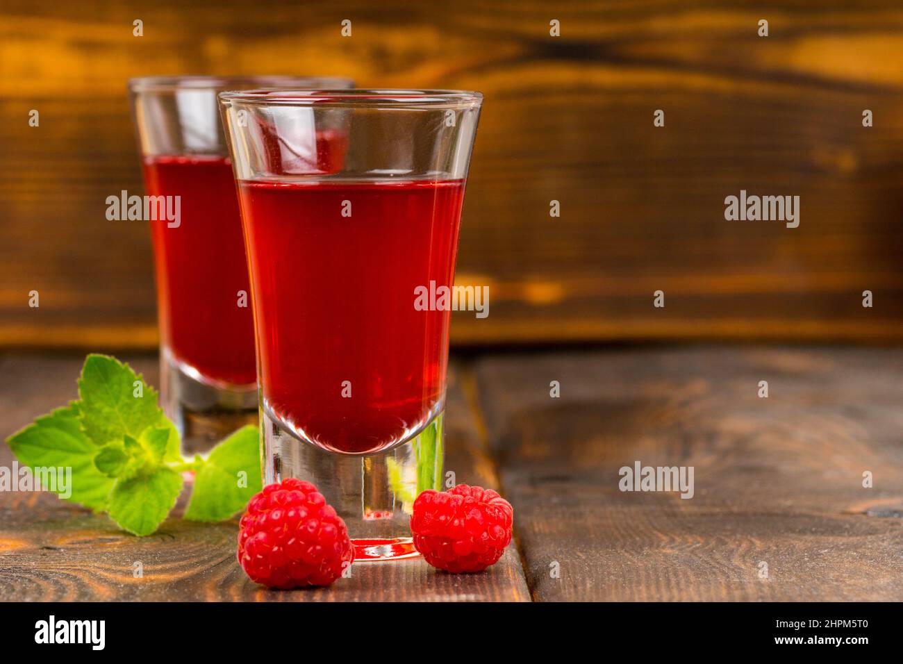homemade raspberry liqueur with mint Stock Photo Alamy
