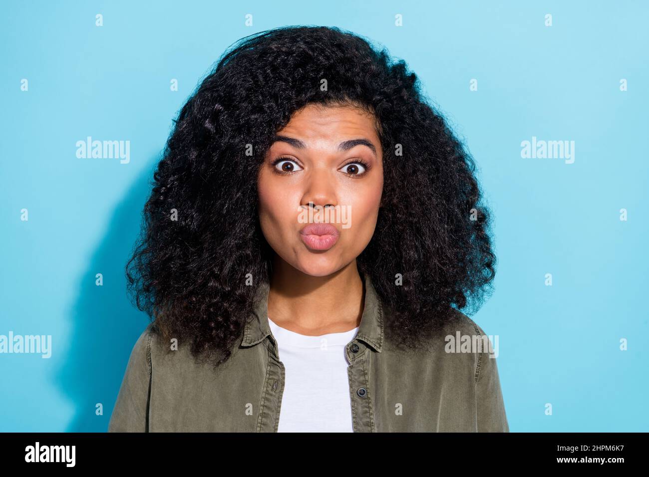 Photo of young pretty african woman pouted lips send air kiss romantic