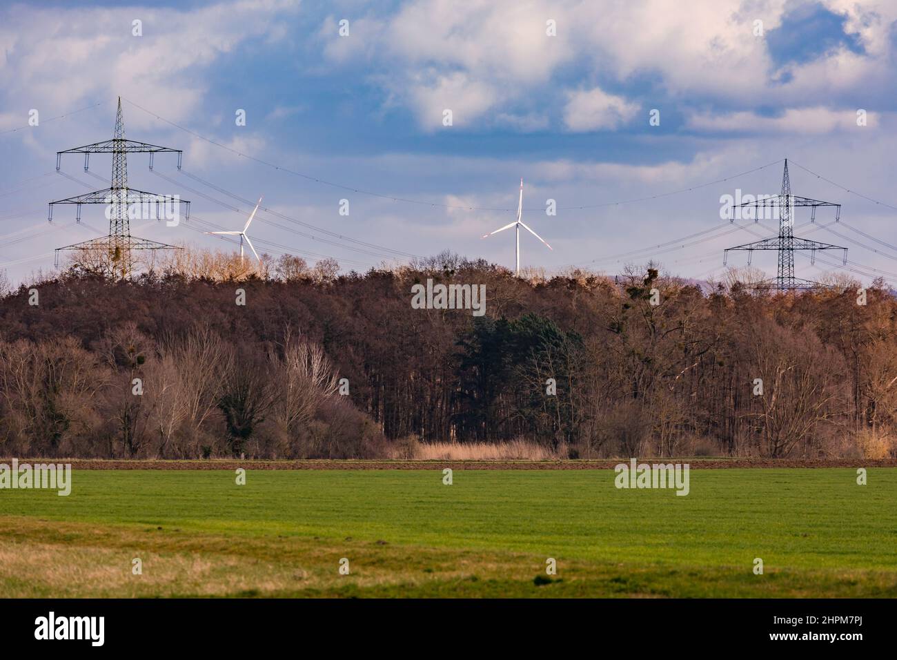 Wind turbines and power lines have a lasting effect on the image of our landscape that can be perceived as disturbing Stock Photo