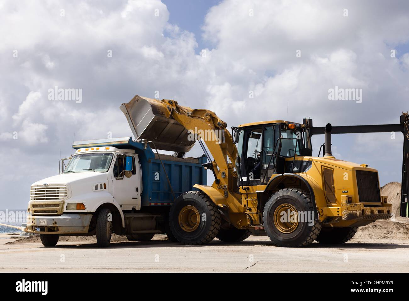 Delivery of dirt. Automotive equipment loading black soil Stock Photo Alamy