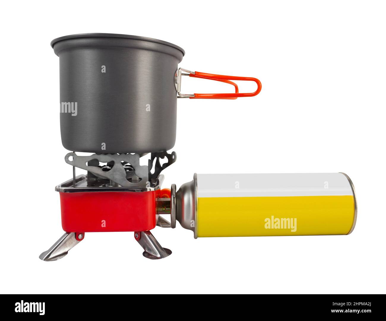 Isolated photo of metal camping gas stove with gas bottle and cup on