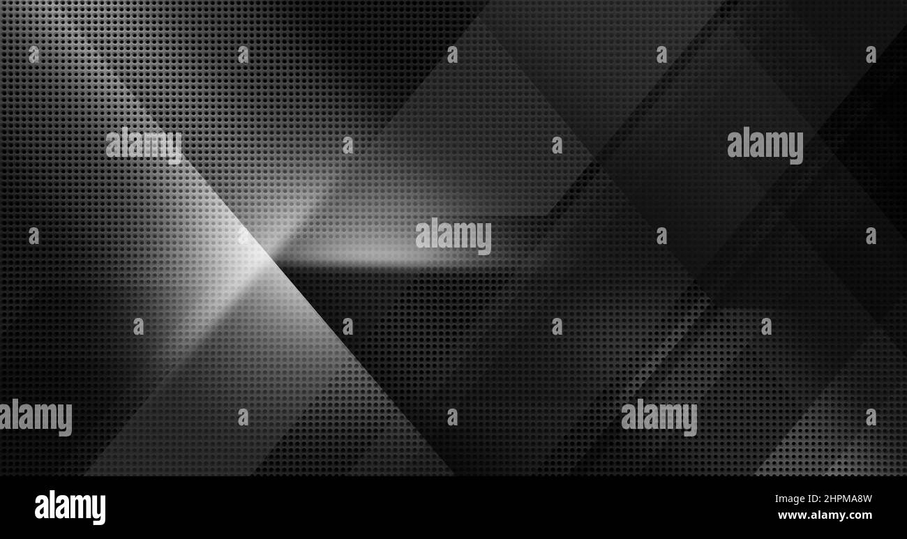 Spot lit perforated black metal plate. Abstract tech geometric modern background close-up Stock Photo