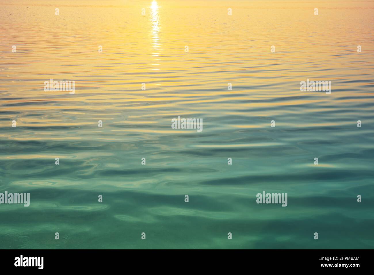 Calm sea surface at sunset Stock Photo