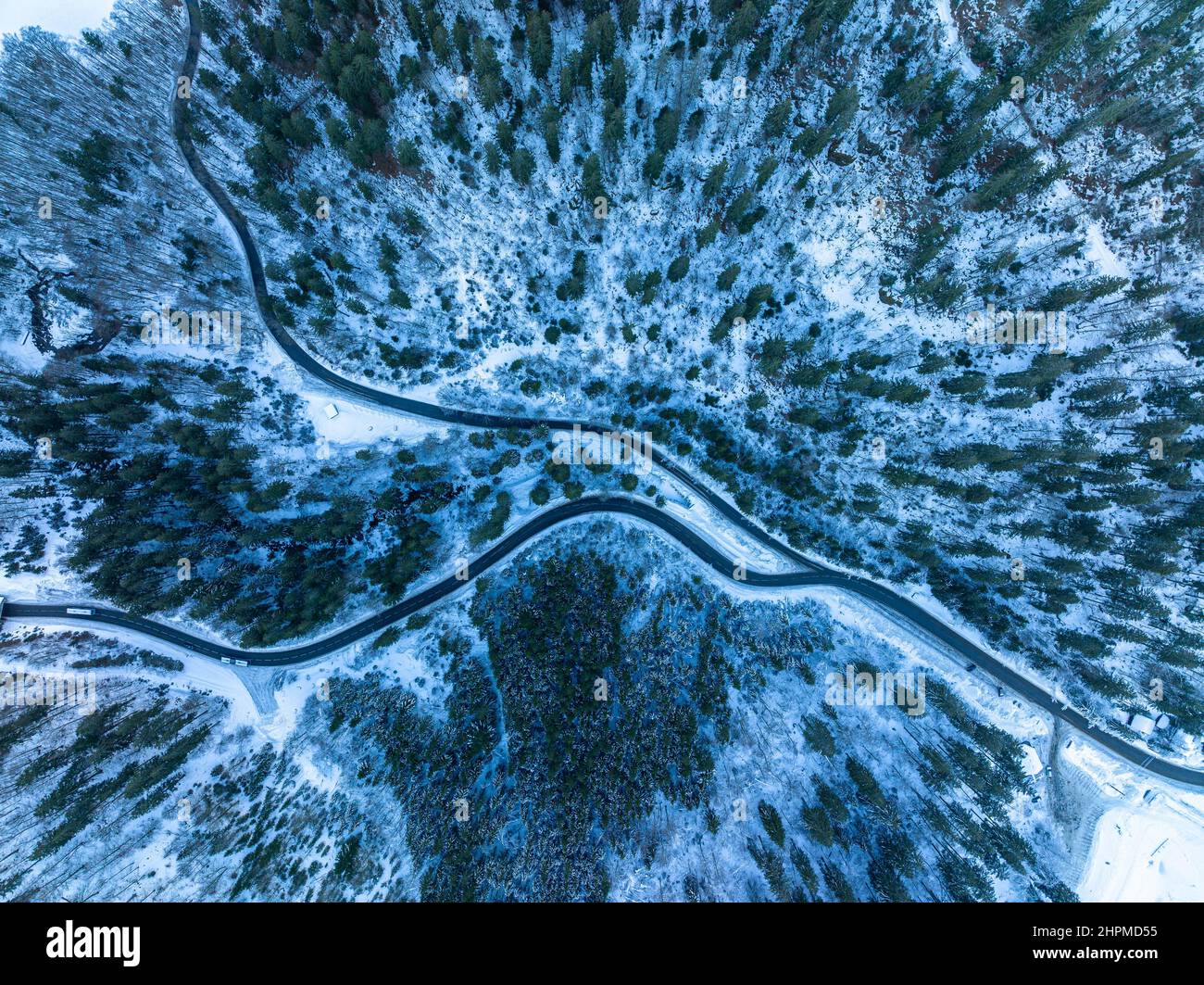 top down aerial shot of curvy wild road in mountains of France Stock Photo