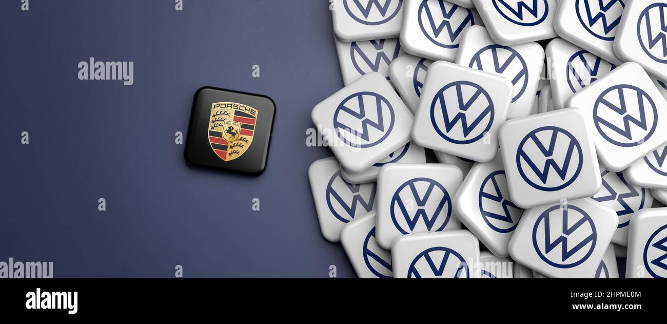 Volkswagen spinning off the Porsche brand by going public. Logos of the German mass car manufacturer Volkswagen VW and a logo of Porsche. Stock Photo