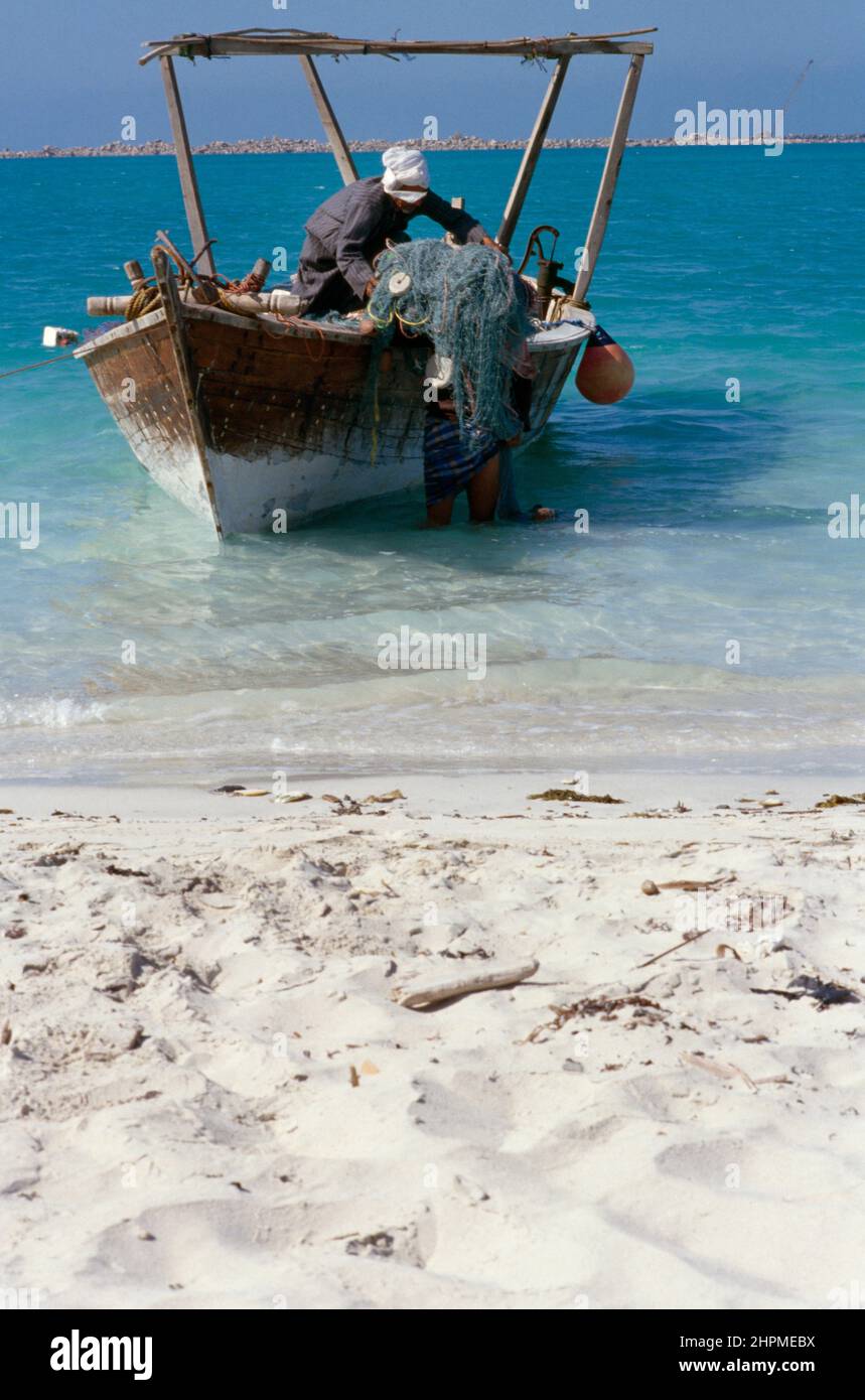 Fisherman and fishing boat Dubai UAE Stock Photo