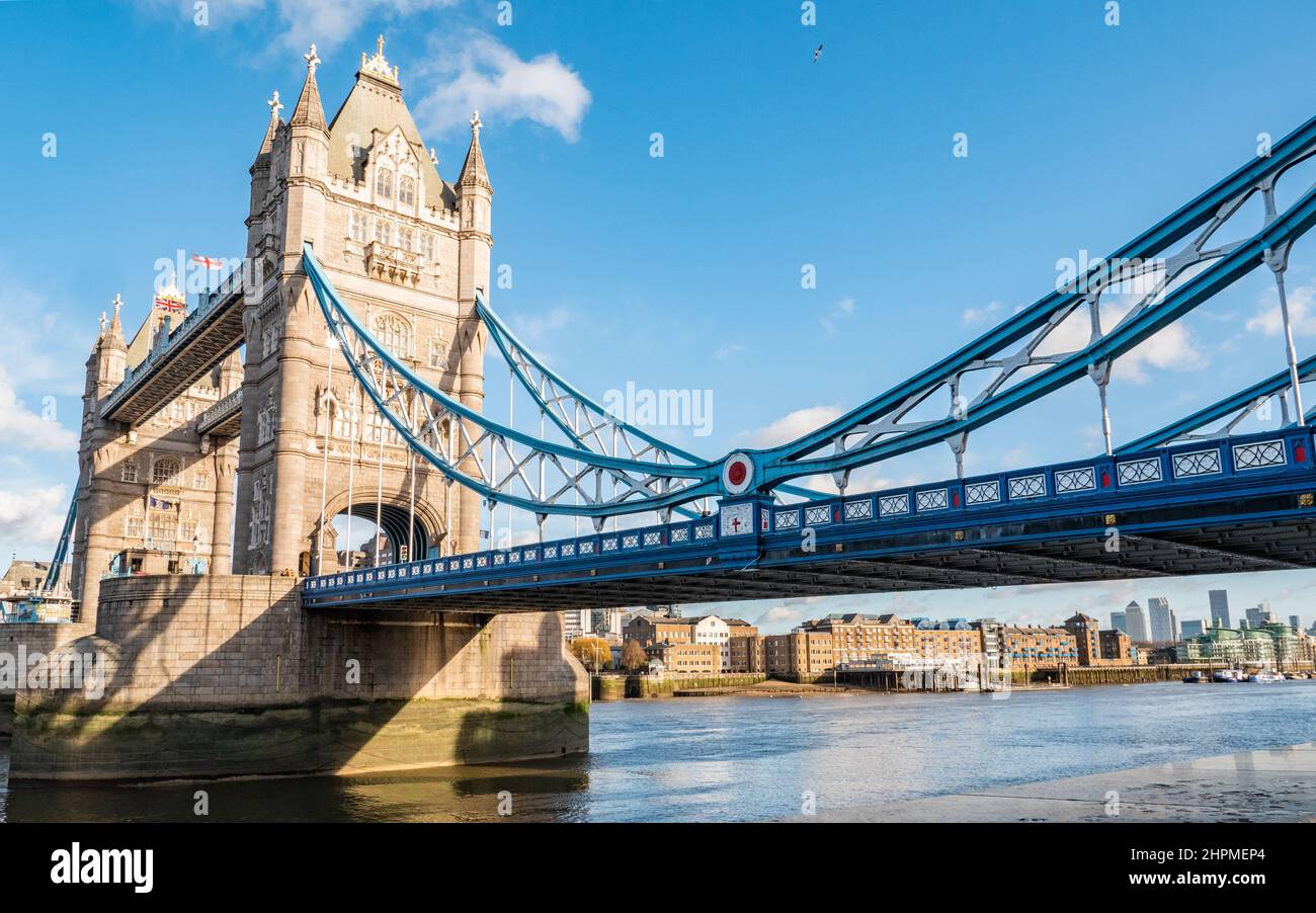 London Tower Bridge. A view from the south bank of the famous landmark crossing the River Thames with Wapping warehouses on the north bank visible. Stock Photo