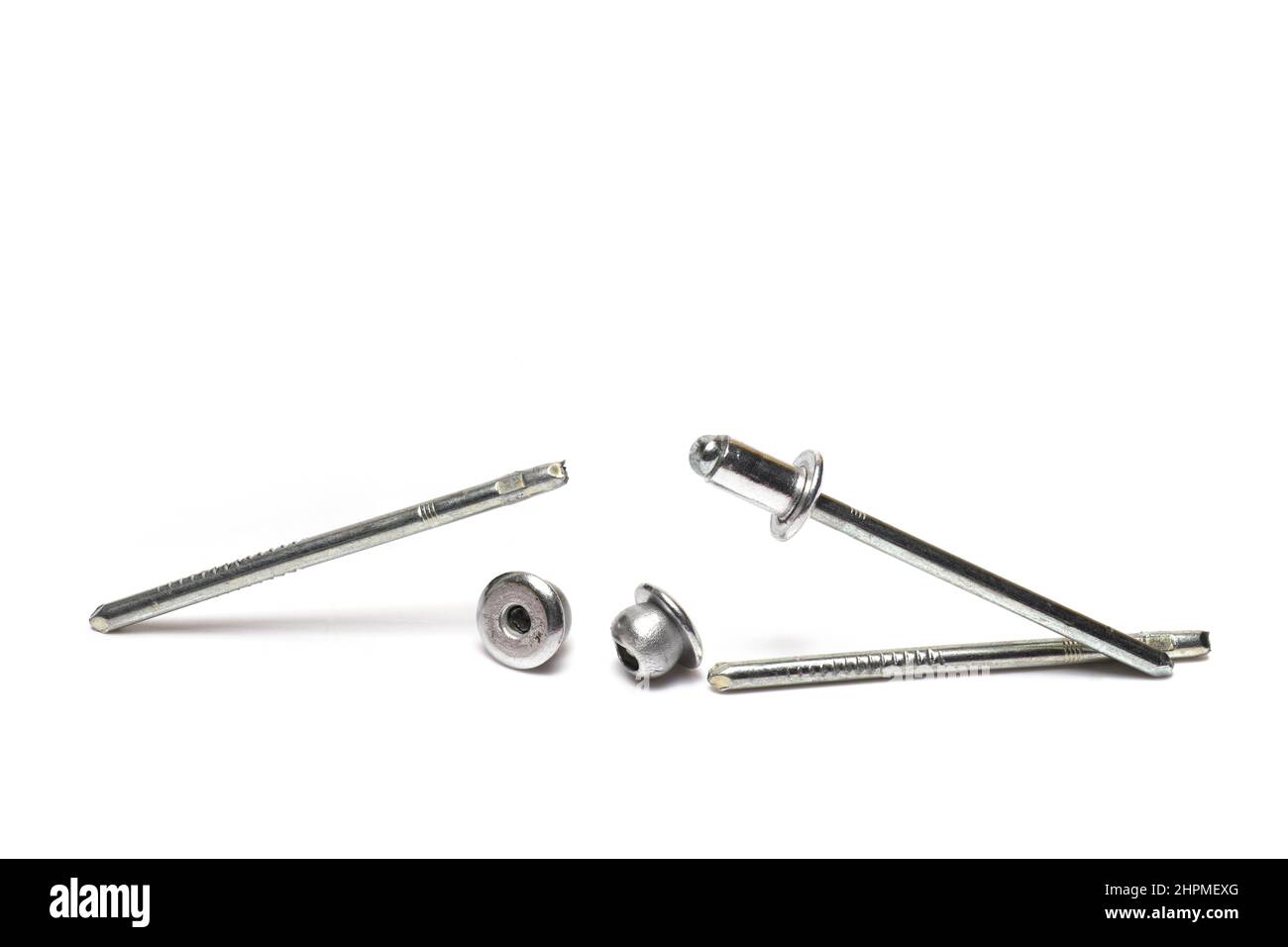 Close up of silver metal blind rivets for joining sheet metal in sheet