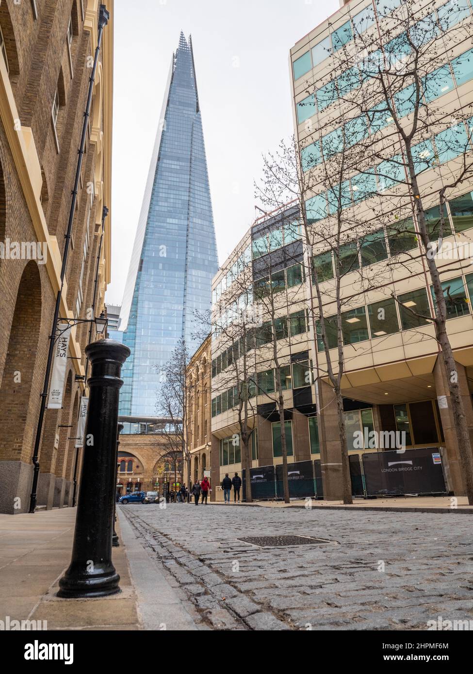 The Shard, London. A low, wide angle view of the gentrified former industrial area of Southwark dominated by the modern London landmark. Stock Photo