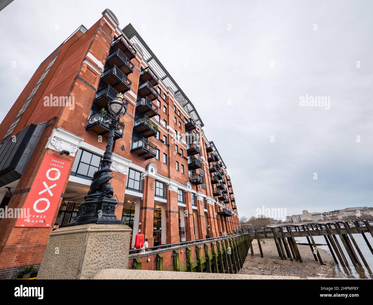The Oxo Building, London. A low, wide angle view of the renovated River Thames landmark housing exclusive flats and various design and gallery shops. Stock Photo