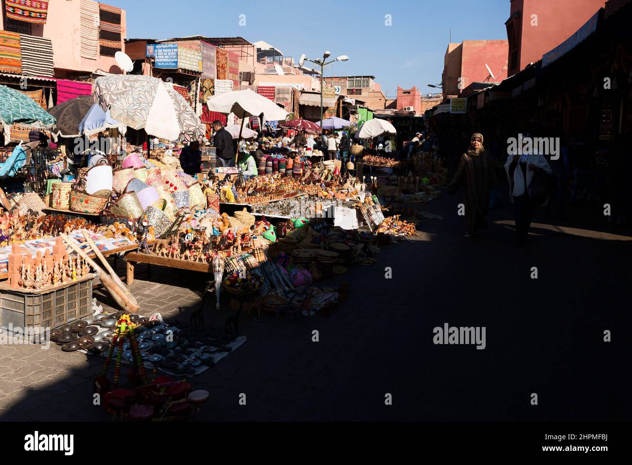 Two women walking around the open air souk in Marrakesh, Morocco Stock Photo