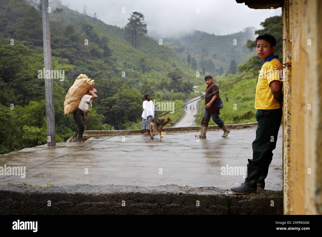 Rain tendency with carrier at the jungle road at the village Yuhilxa Guatemala. Stock Photo