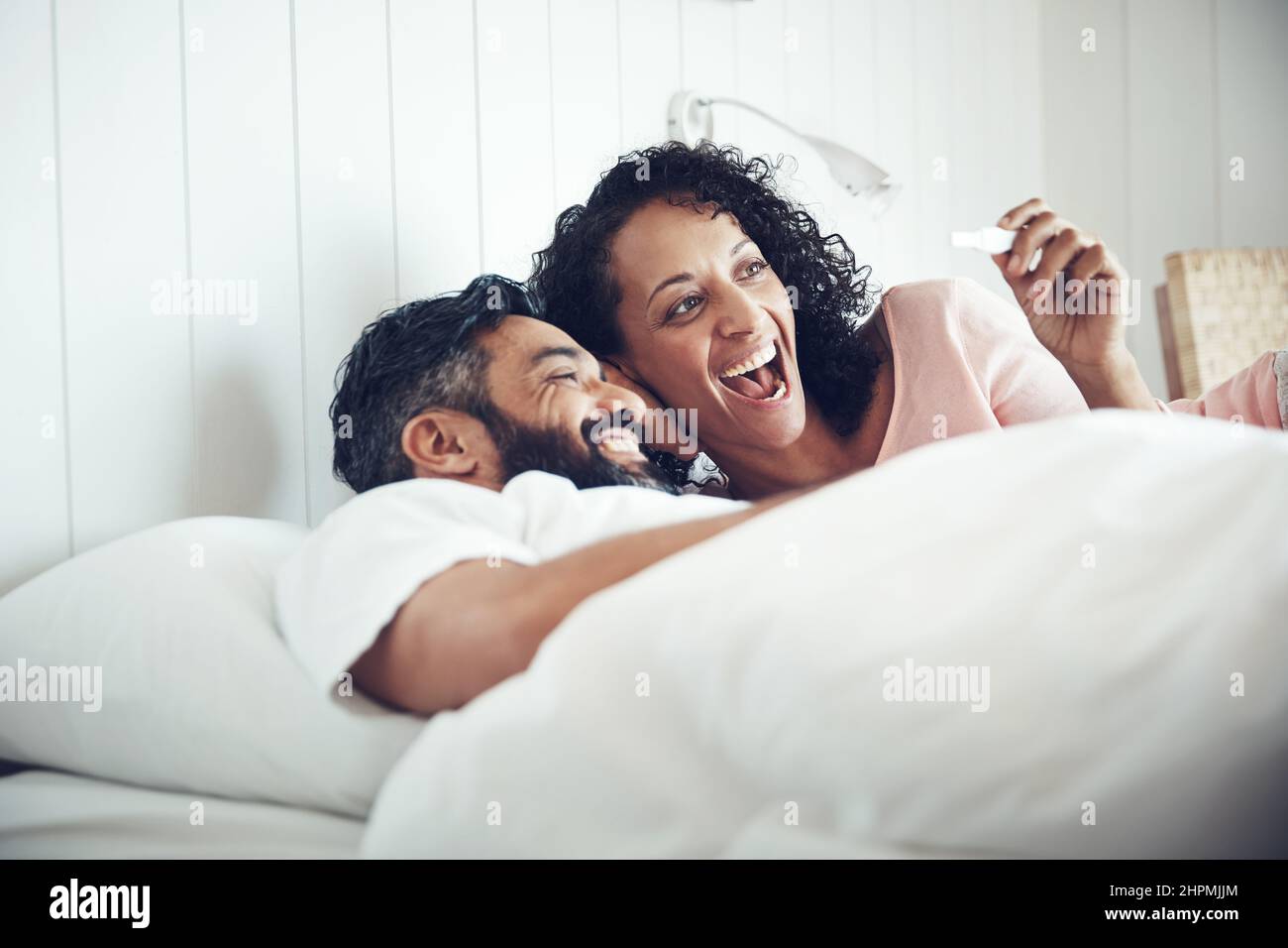 Oh baby, were having a baby. Shot of a mature couple feeling happy after taking a home pregnancy test. Stock Photo