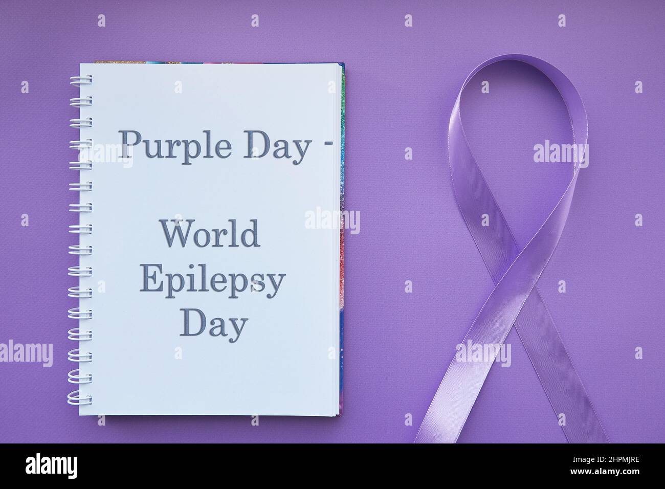 Purple Day - World Epilepsy Day, March of 26. Symbol of Epilepsy Day. Ribbon and text. Stock Photo