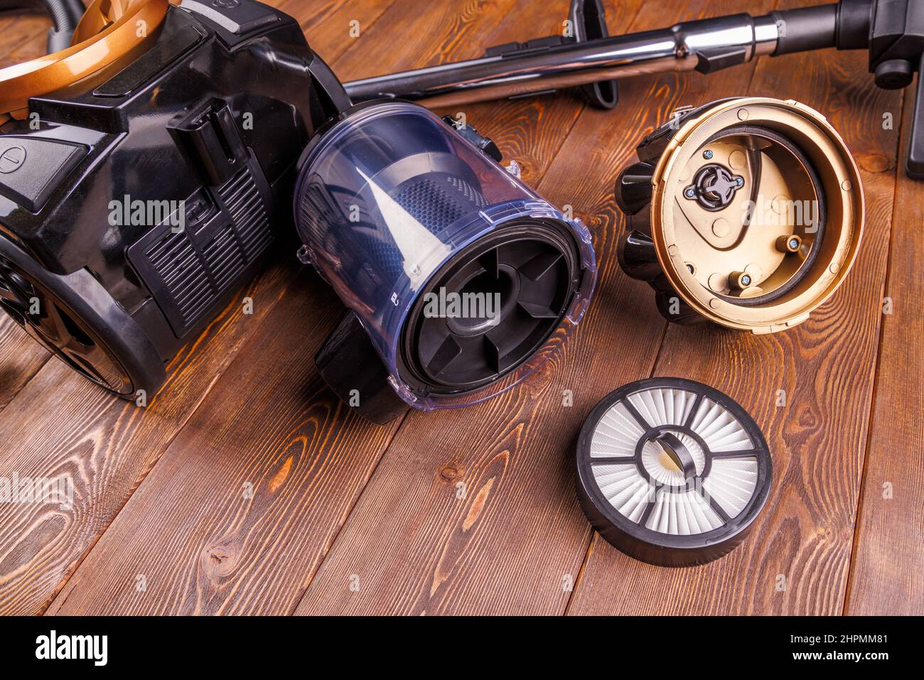 disassembled bagless vacuum cleaner and it's parts tube with HEPA