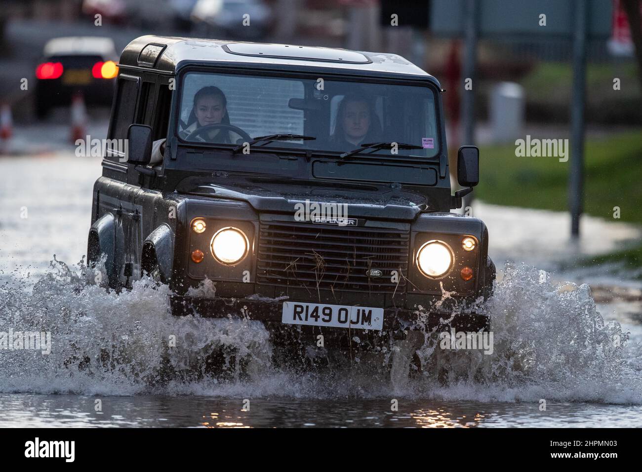 A fourwheel drive car drives through the floods on Leeds Road
