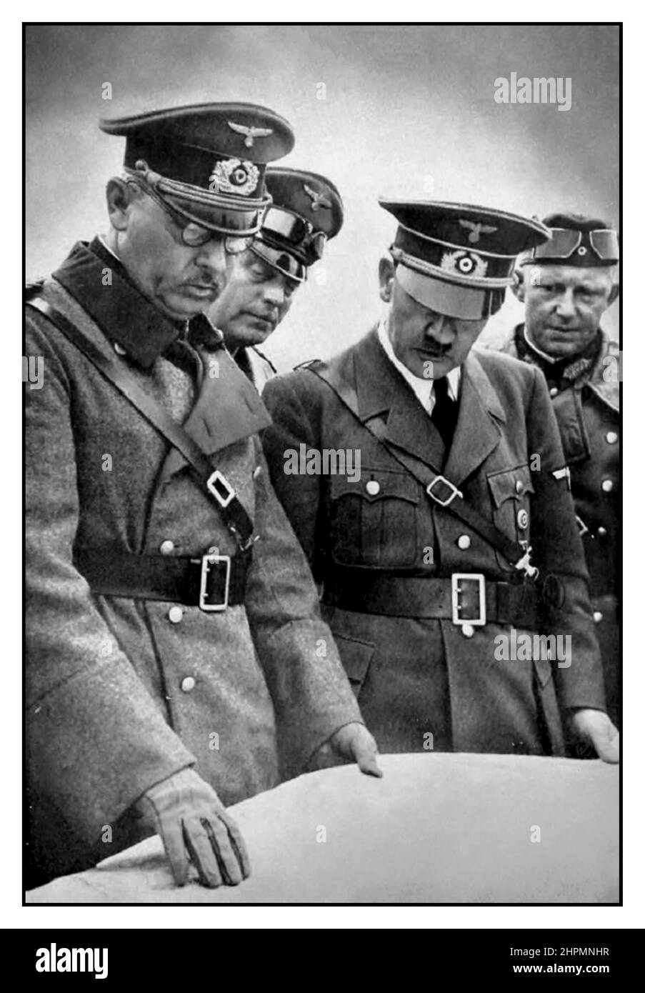 WW2, Poland Second World War 1939, Polish invasion occupation  campaign, Adolf Hitler discusses battle plans explained to him on the Polish front by (on left) Generaloberst Wilhelm List, Commander-in-Chief of the 14th Army. Between List & Adolf Hitler, General Wilhelm Keitel, Chief of the High Command of the Wehrmacht. Far right General Alfred Jodl, chief of the Wehrmacht command staff in the Wehrmacht High Command.WW2 Adolf Hitler  & Field Marshal Whilhelm Keitel look at battle plans for the invasion of Poland 1939 World War II Stock Photo