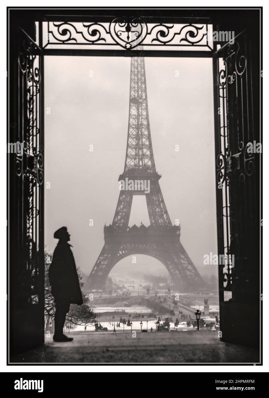 EIFFEL TOWER 1919 Paris retro vintage historic B&W with Eiffel Tower and French soldier on guard, taken in winter at the end of World War 1 by Lewis Wickes Hine 1874-1940 photographer Stock Photo