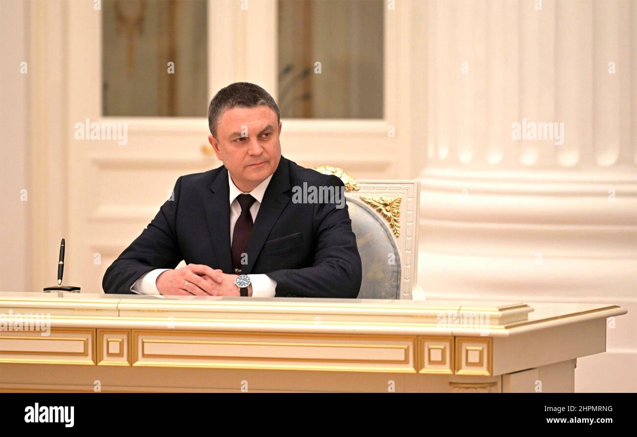 Moscow, Russia. 21st Feb, 2022. The leader of the separatist Lugansk People's Republic Leonid Pasechnik, watches as Russian President Vladimir Putin signs an executive order recognizing the Ukrainian regions of Donetsk and Lugansk during a ceremony at the Kremlin, February 21, 2022 in Moscow, Russia. Credit: Alexei Nikolsky/Kremlin Pool/Alamy Live News Stock Photo