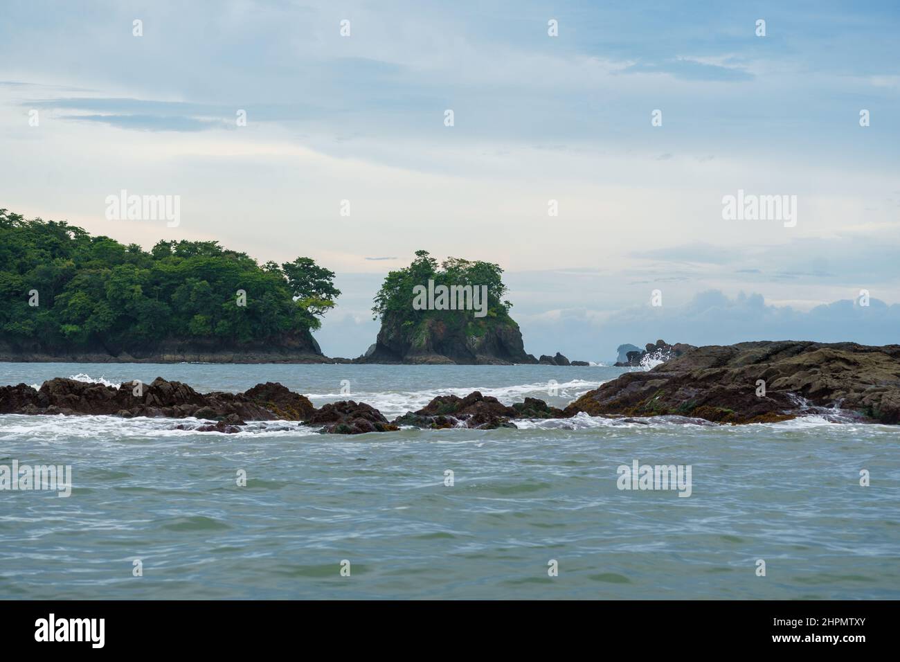 Rocks and uninhabited, forested islands along the Pacific coast of Panama Stock Photo