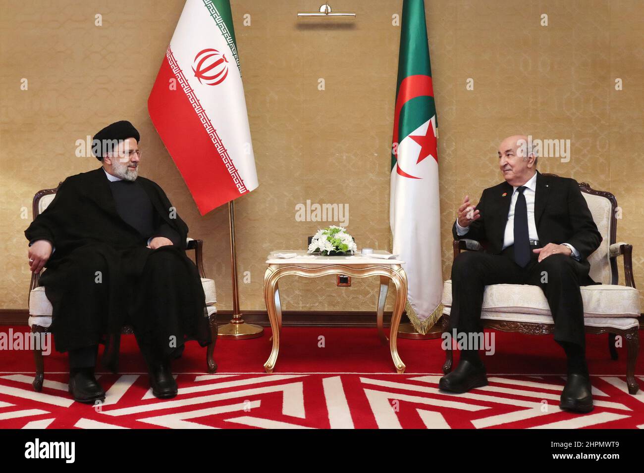 Doha, Doha, Qatar. 22nd Feb, 2022. A handout photo made available by the Iranian presidential office shows, Iranian President EBRAHIM RAISI meets Algerian President ABDELMADJID TEBBOUNE as part of the 6th Gas Exporting Countries Forum (GECF) in Doha, Qatar on February 22, 2022. (Credit Image: © Iranian Presidency via ZUMA Press Wire) Stock Photo