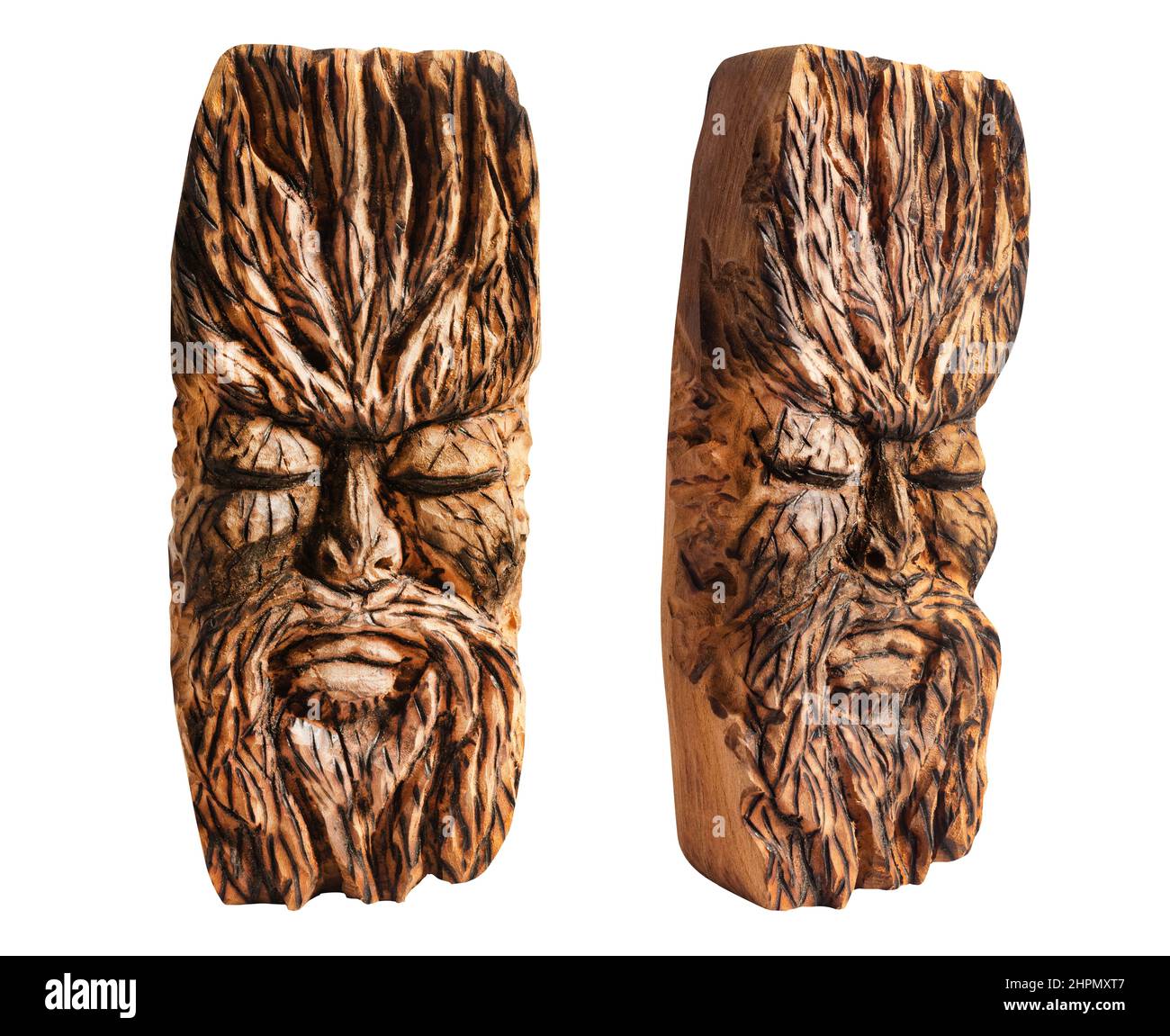 Isolated photo of fantasy face ancient pagan god totem idol carved in wood on white background. Stock Photo