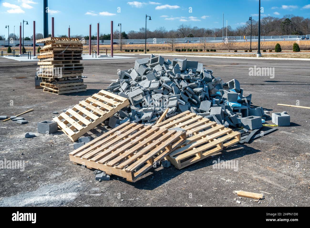 Horizontal shot of a pile of broken cinder blocks near a construction site. Stock Photo