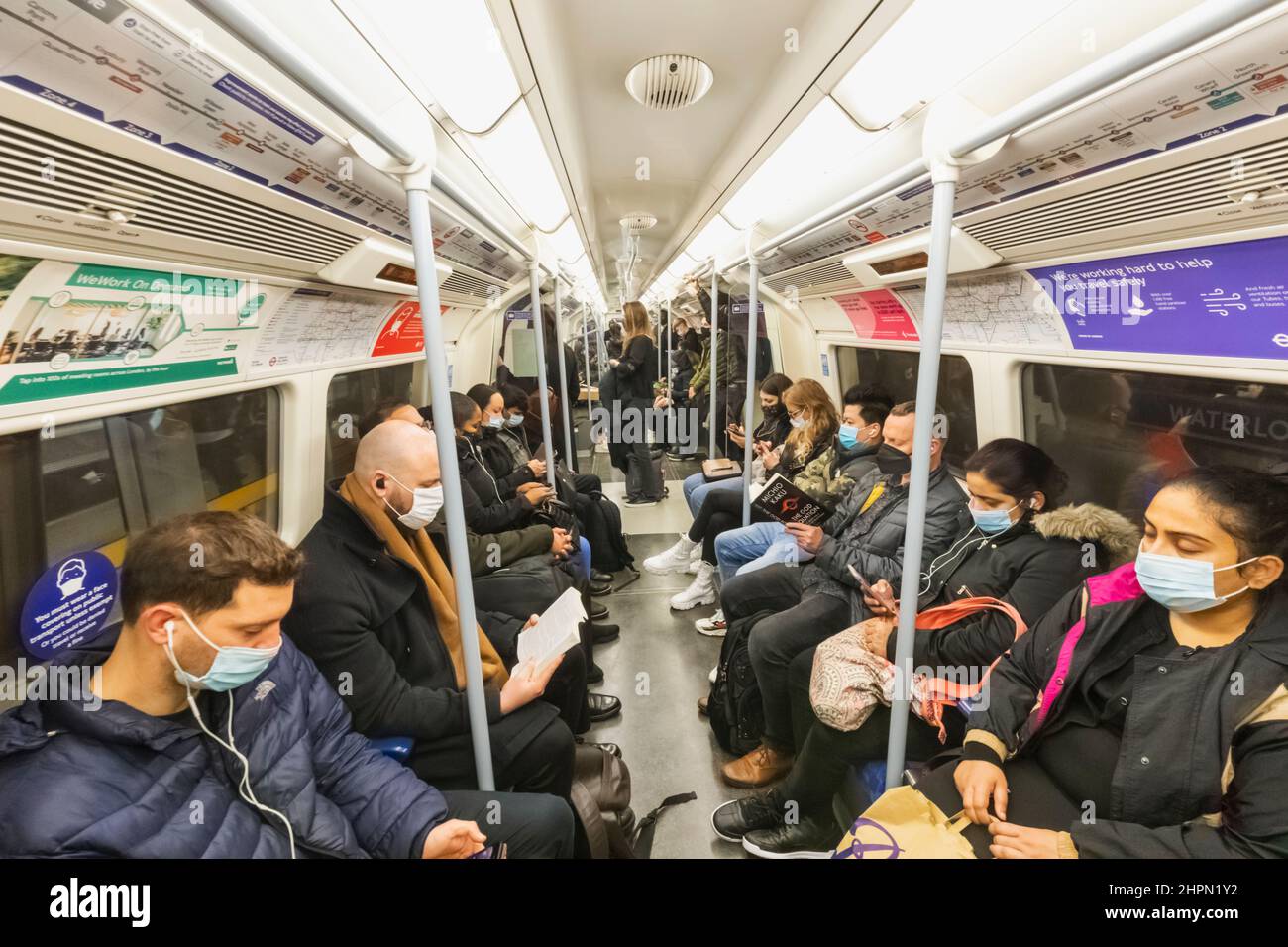 England, London, Subway Passengers Wearing Surgical Masks Stock Photo
