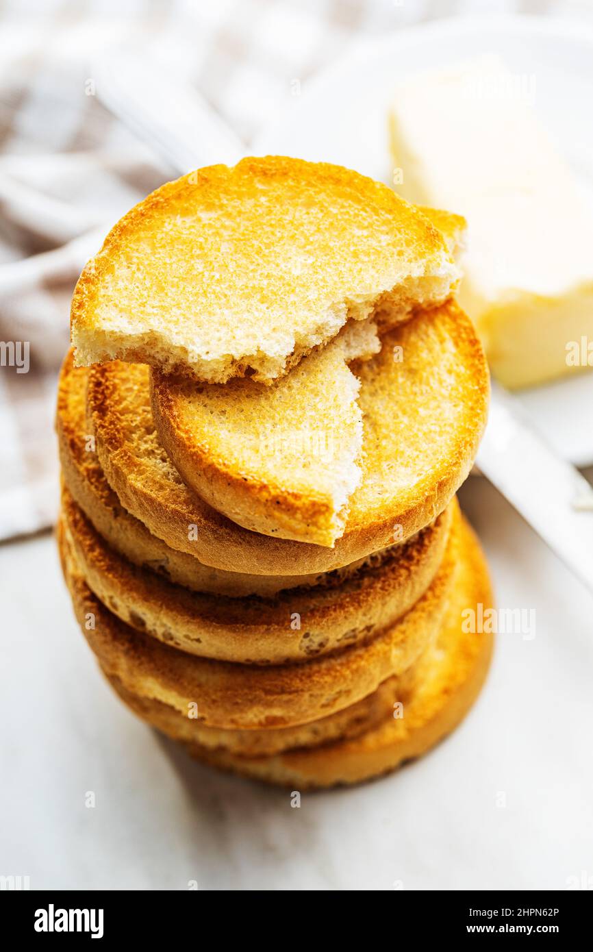Dietary rusks bread. Crusty biscuits on kitchen table. Stock Photo