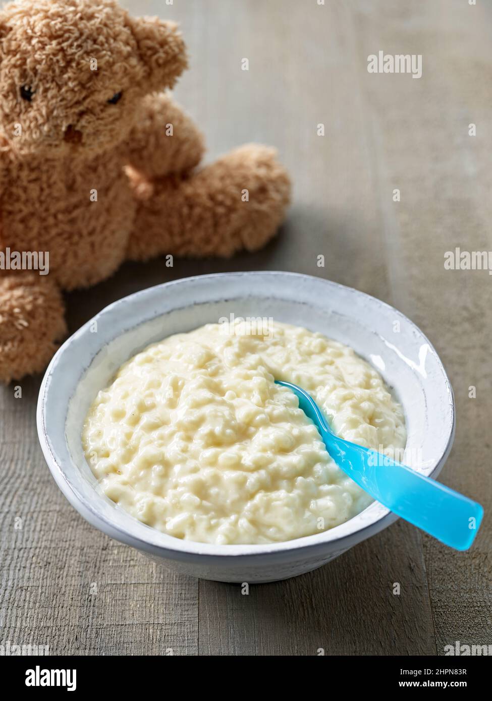 Baby eating rice pudding hires stock photography and images Alamy