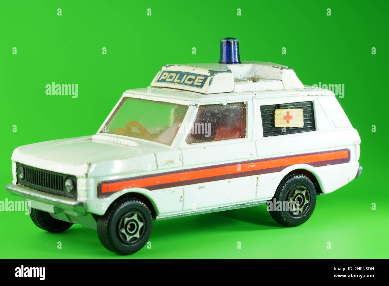Retro Range Rover Police Accident Model Car, white on green background. Stock Photo