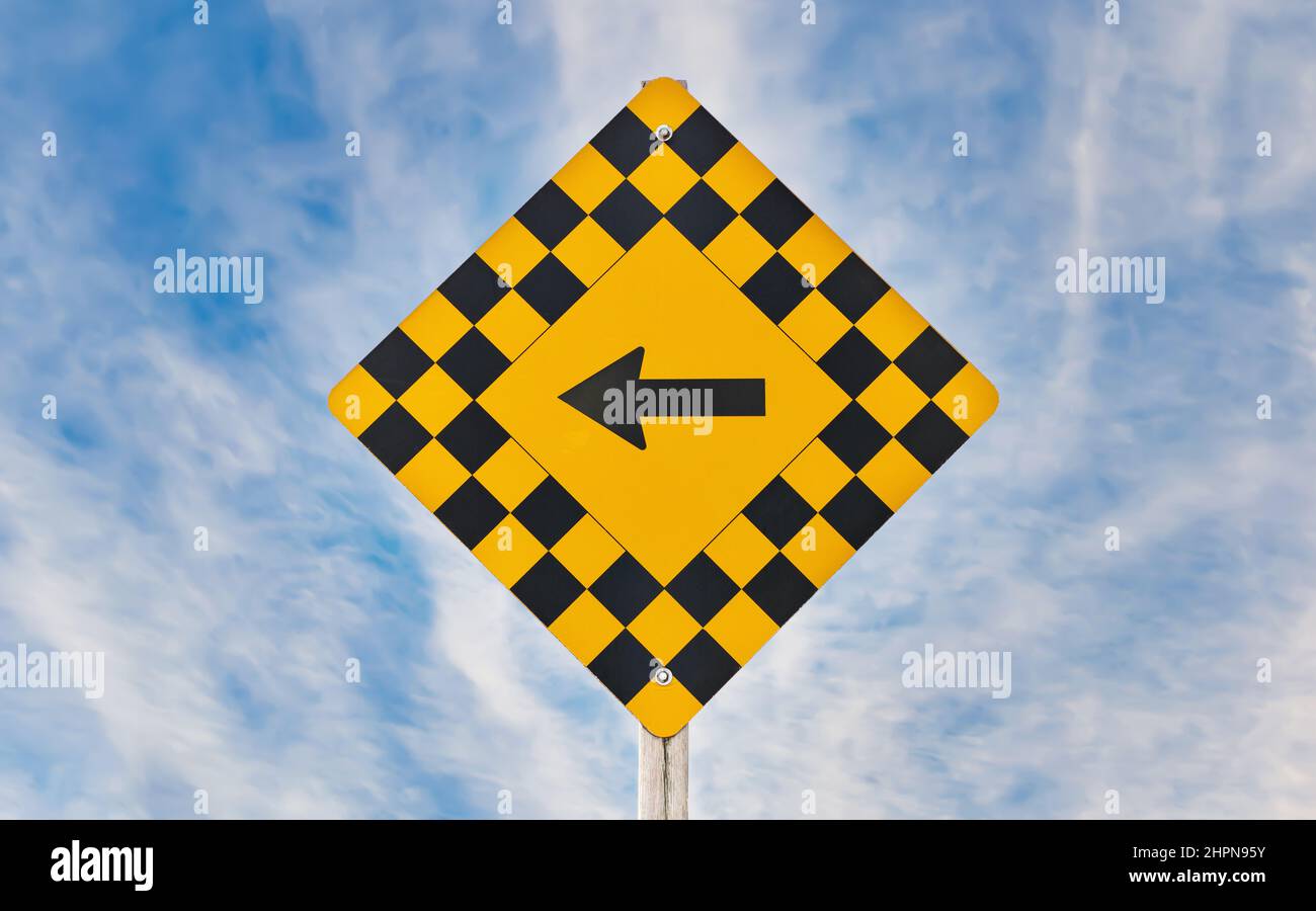 Road Sign withLeft Arrow Isolated on against a Dramatic Blue Sky Stock ...