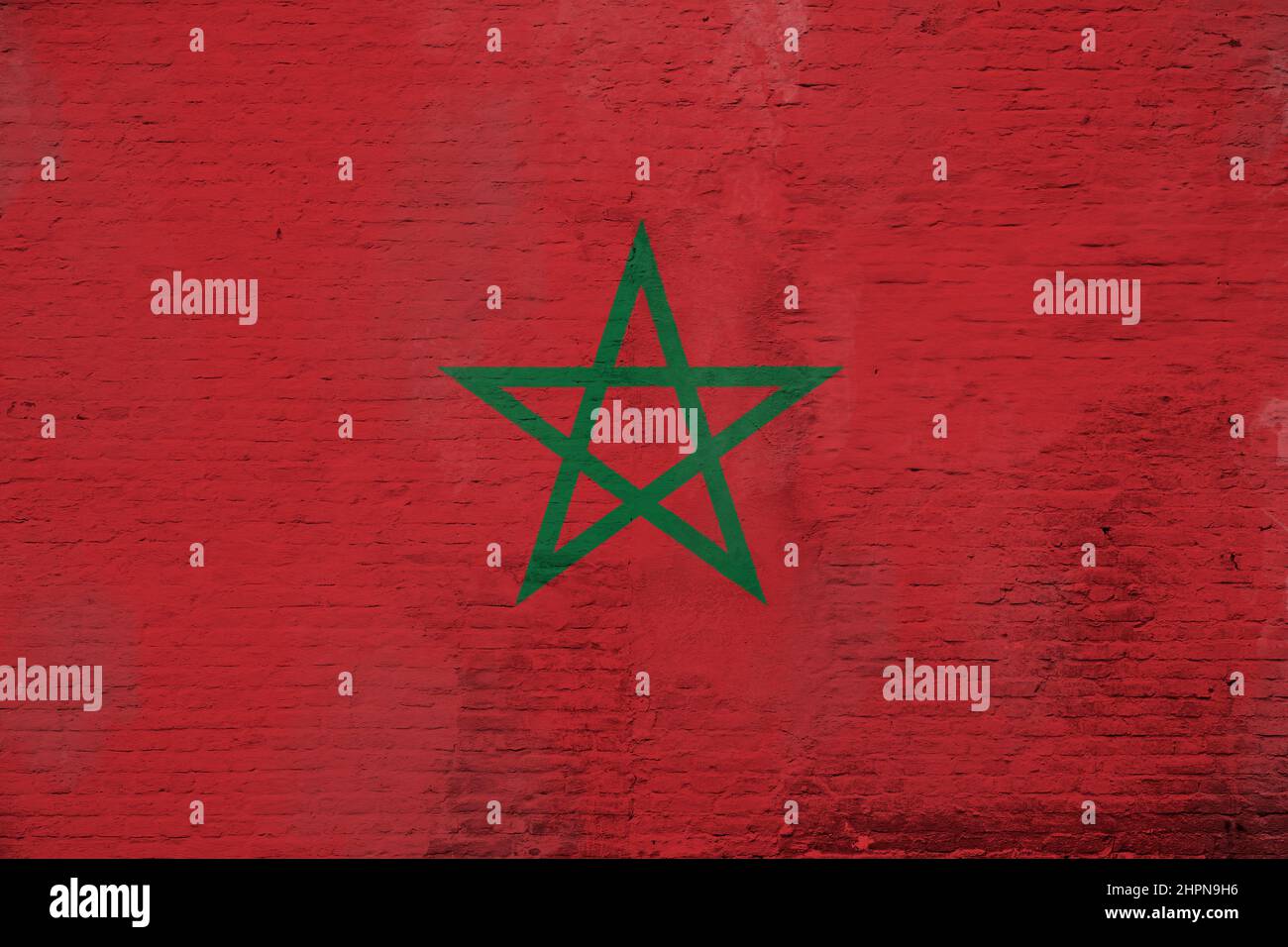 Full frame photo of a weathered flag of Morocco painted on a plastered ...