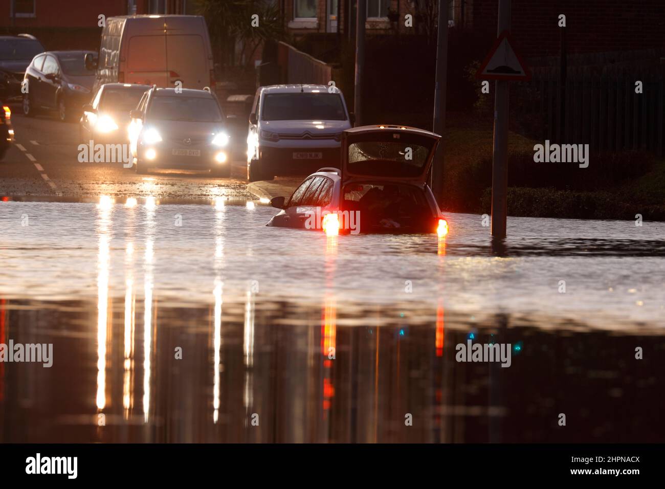 A car becomes stranded on Station Road in Allerton Bywater during floods brought by Storm Franklin Stock Photo