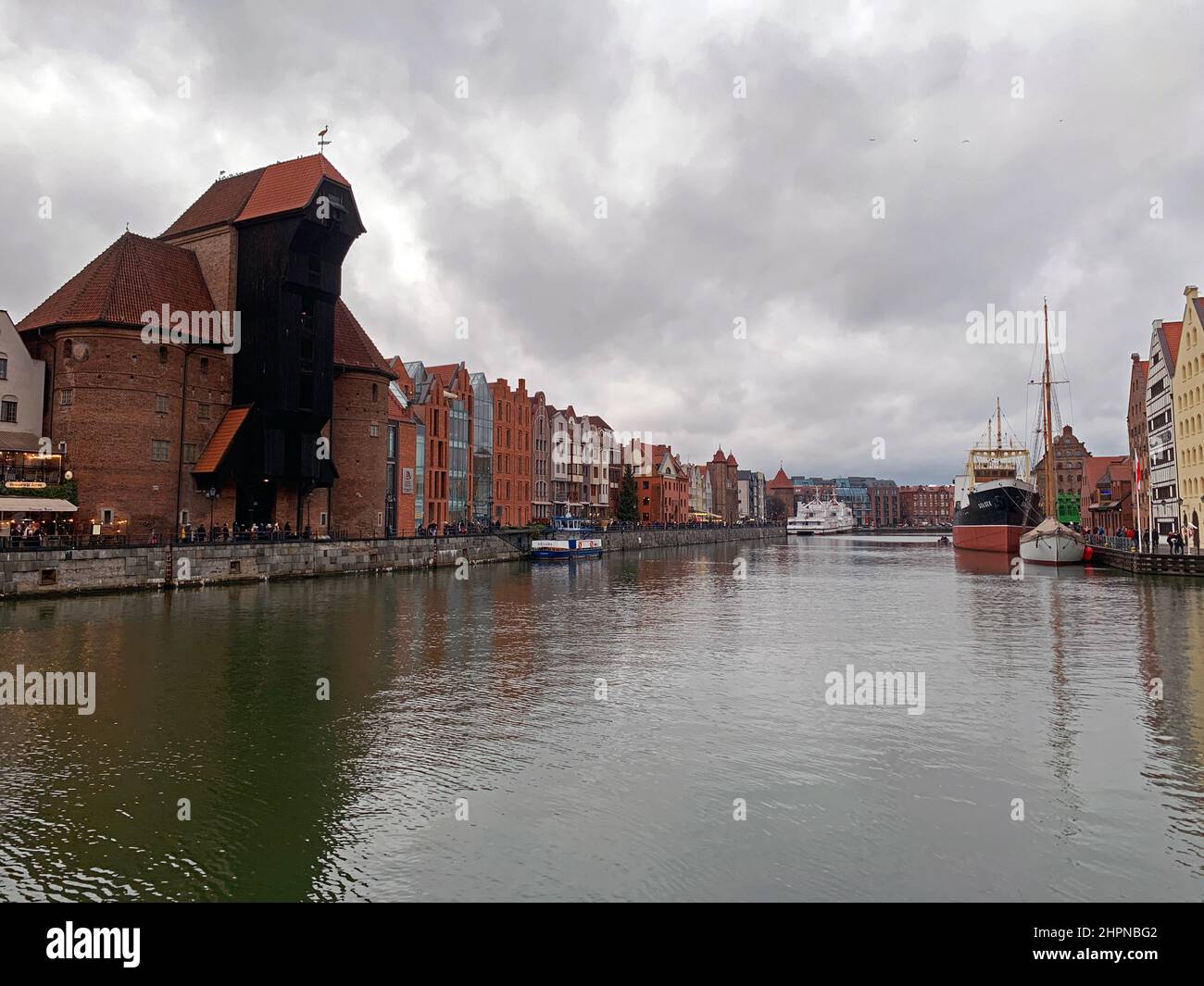 The historical Brama Żuraw black building on the Nowa Motlawa river in Gdansk in Poland Stock Photo