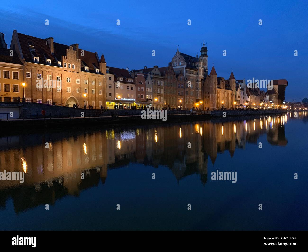 Dramatic picture of the historical buildings of Gdansk on the cold Nowa Motlawa channel in Poland Stock Photo