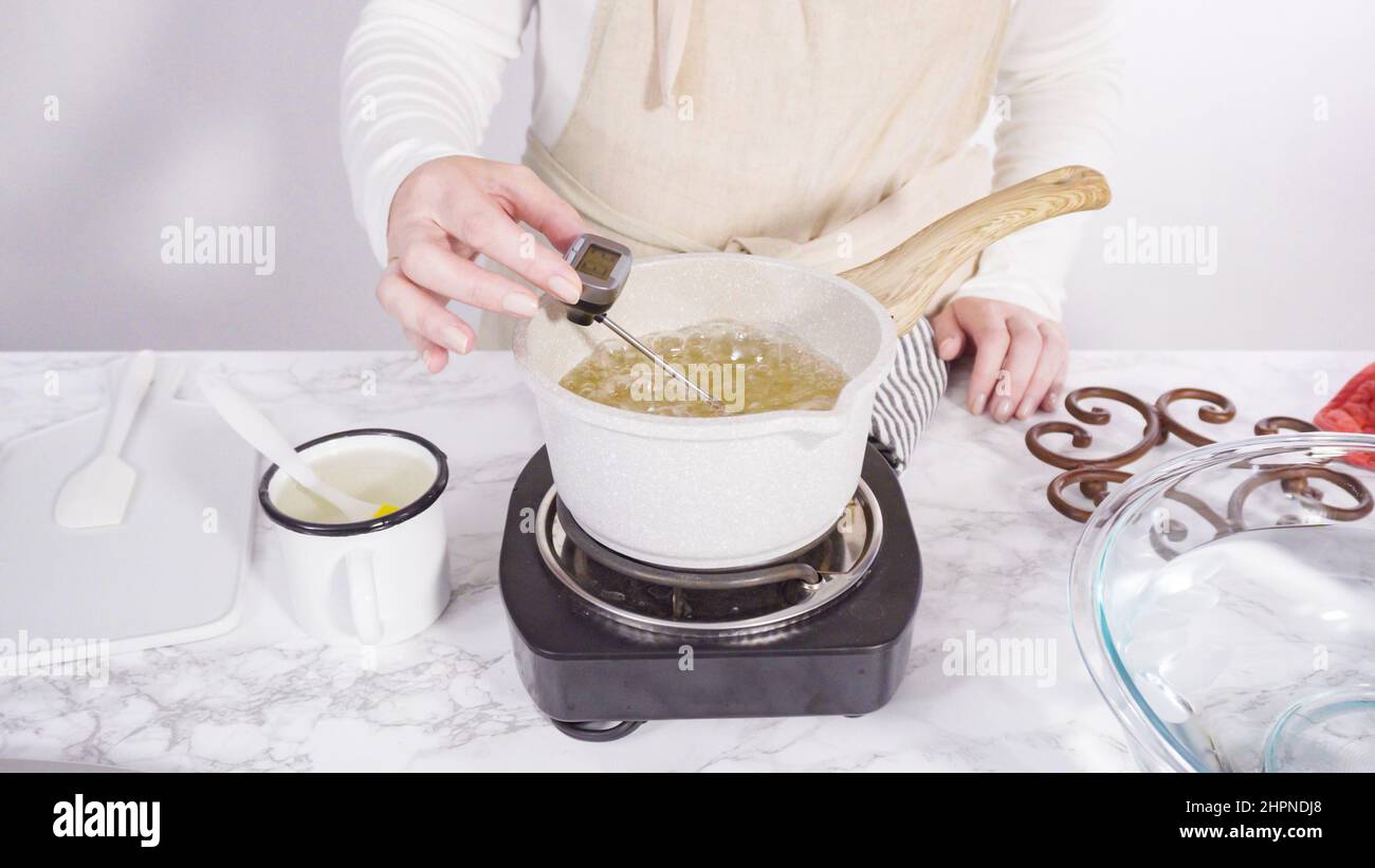 Step by step. Caramelizing sugar in a small cooking pot over the small