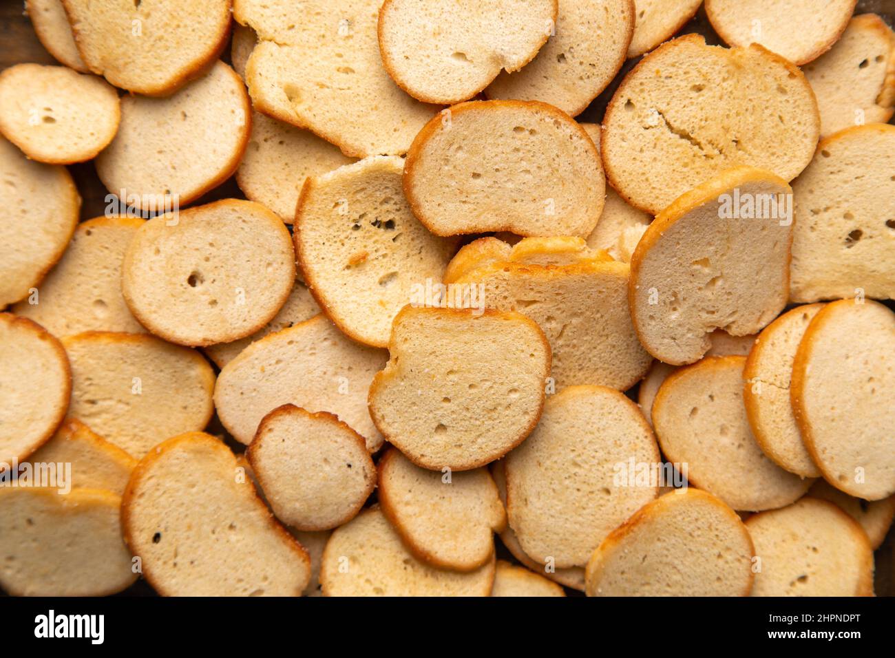 A closeup horizontal image of delicious golden toasted bagel chips. Stock Photo