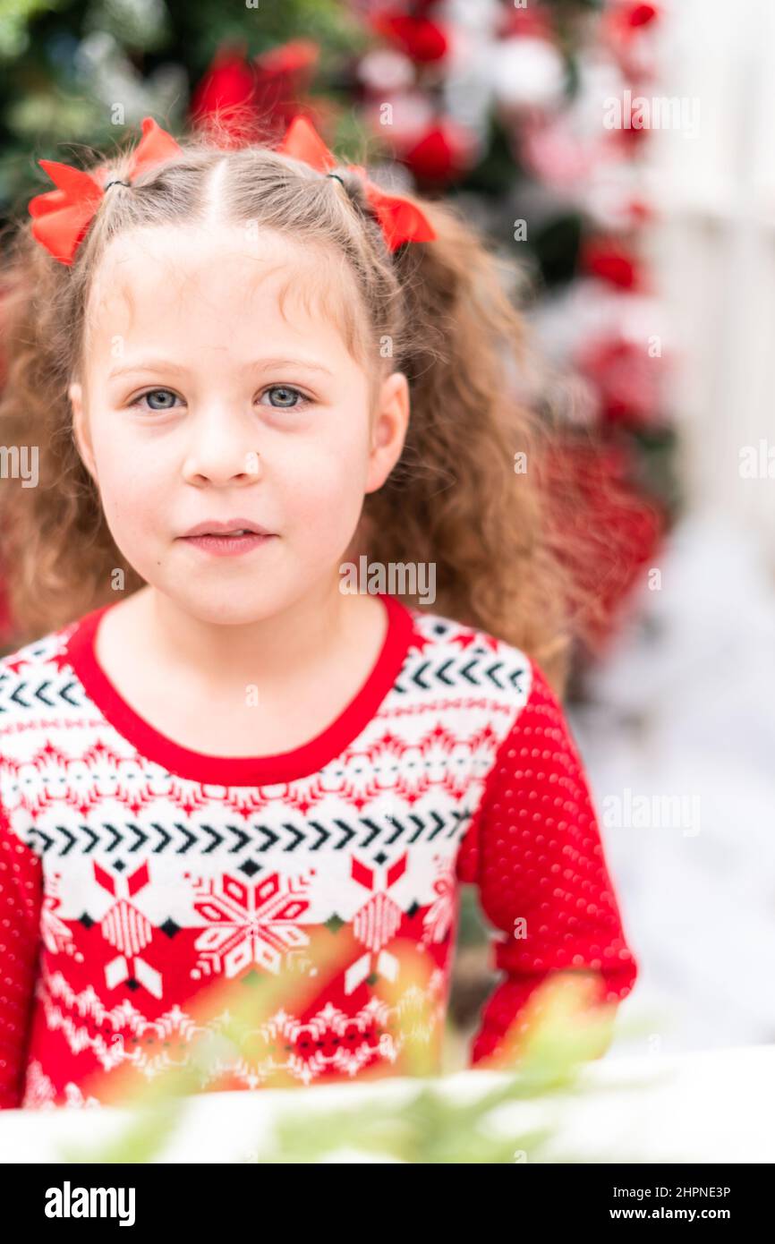 Little girl in red dress at the Christmas tree farm Stock Photo Alamy