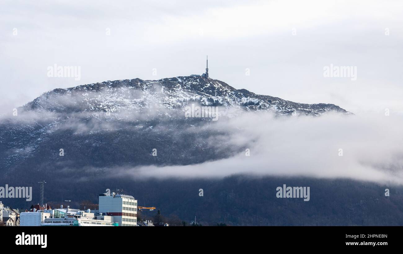 Snow capped Mount Ulriken in Bergen, Norway. View from Puddefjorden fjord. Stock Photo