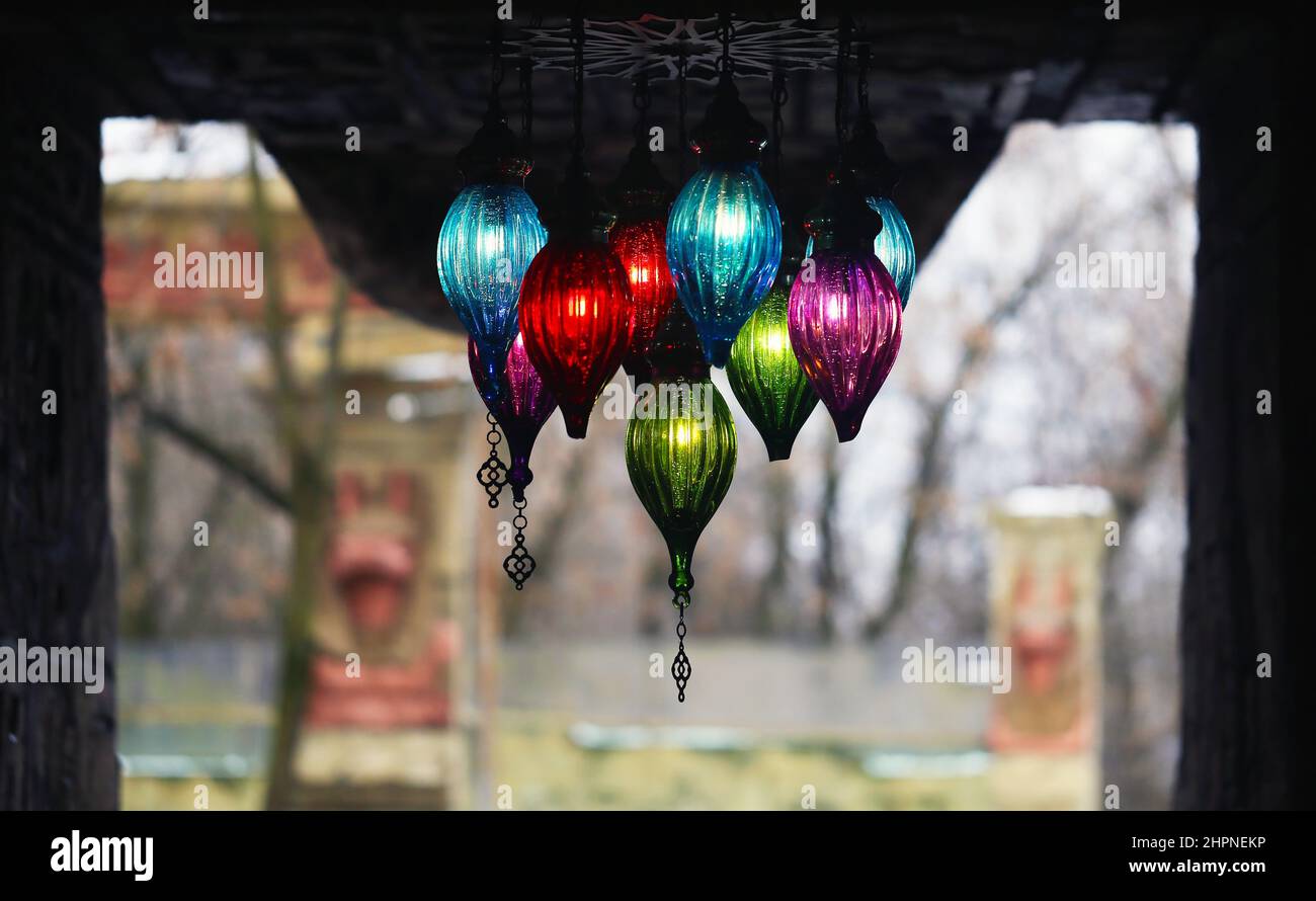 Beautiful multicolored lamps hanging on the ceiling photographed close-up Stock Photo