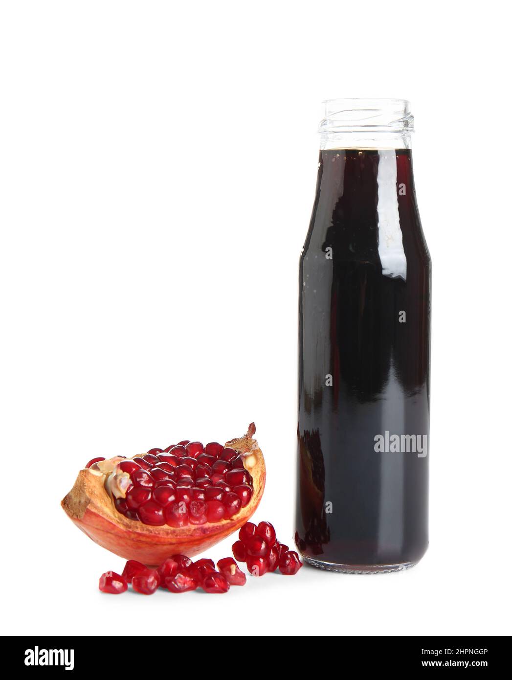 Jar of pomegranate molasses on white background Stock Photo - Alamy