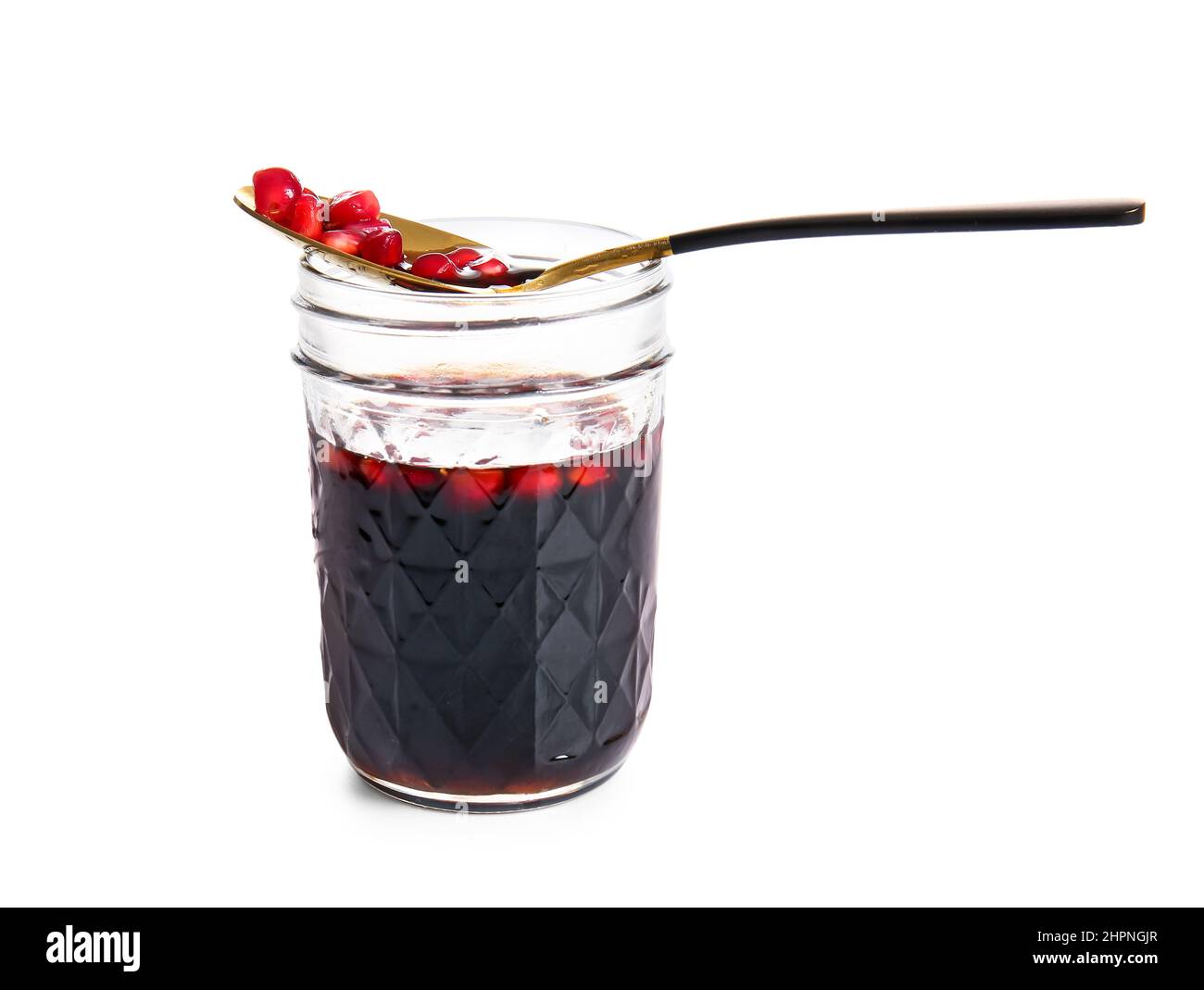Jar of pomegranate molasses on white background Stock Photo - Alamy