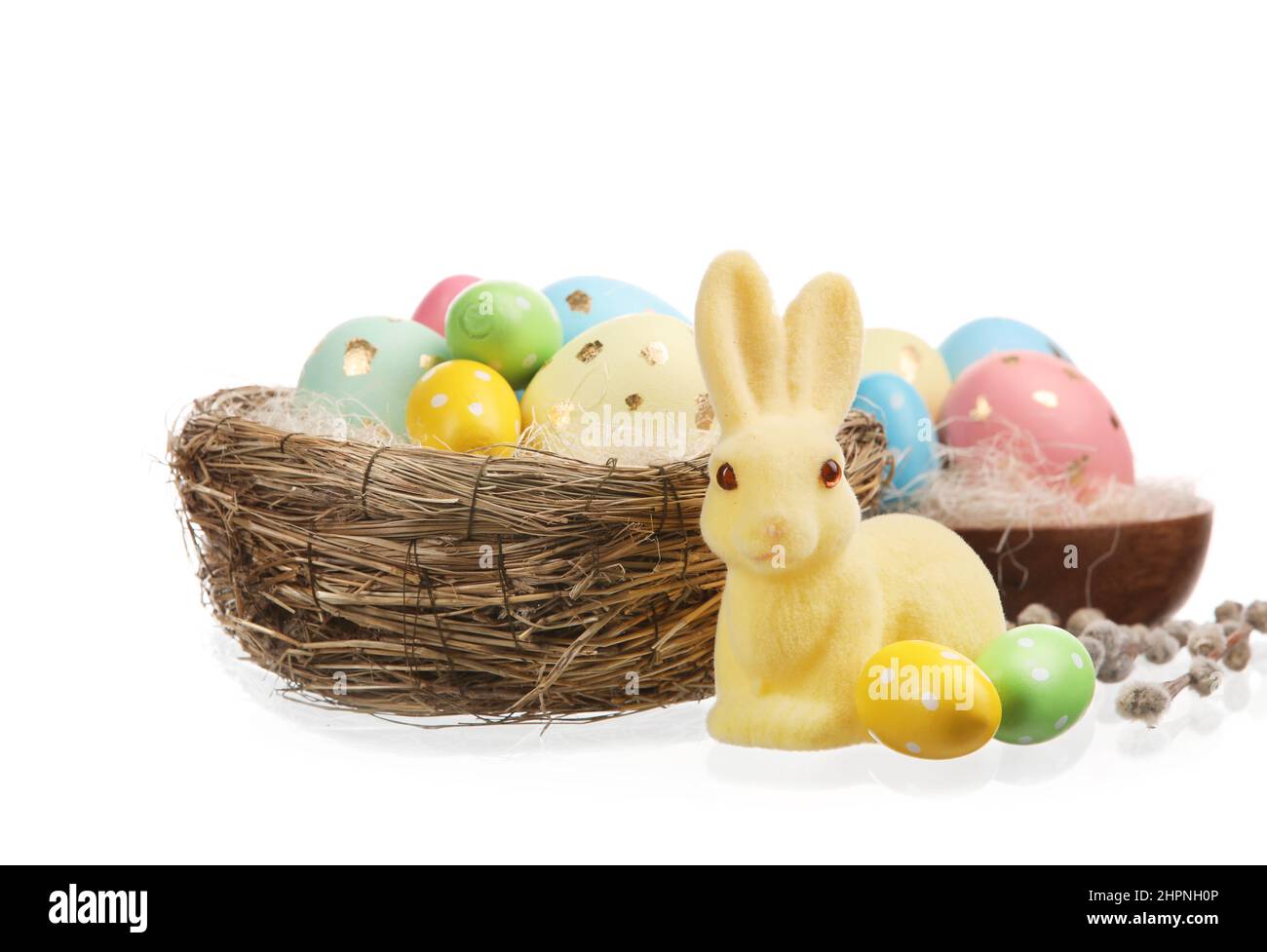 Nest with painted Easter eggs and bunny on white background Stock Photo ...